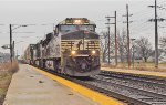 NS 7663 leads westbound stacks through South Bend Amtrak station